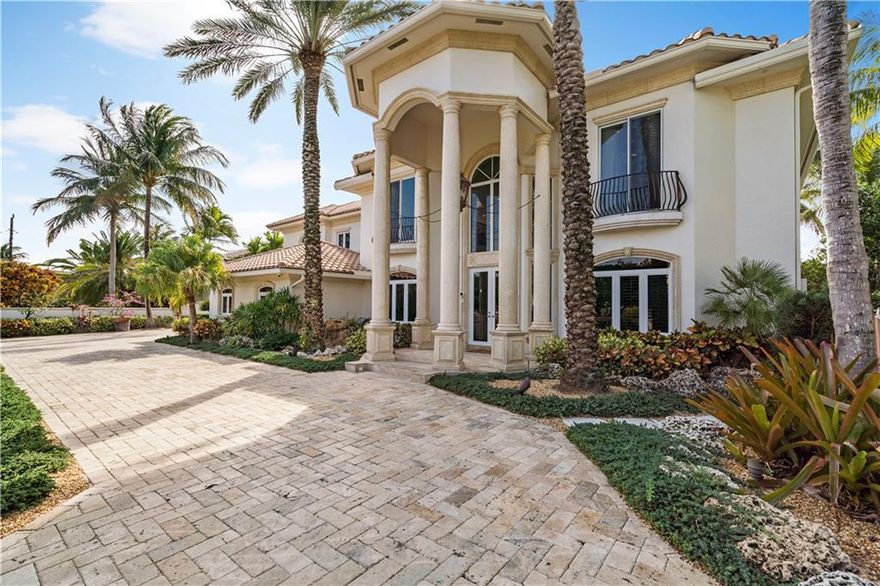 Upon entering this nicely appointed estate home you notice the volume ceilings, plethora of natural light, and serene water views. The open living space downstairs and the large family room with wet bar upstairs provide plenty of options, each boasting a massive patio through French Doors. The chefs kitchen offers an enormous gourmet island, double ovens, a separate dining area, and a 6 burner gas stove plus tons of pantry space.  Master suites upstairs and downstairs, both with oversized walk-in closets provides options depending on your needs. Outside you will find a gorgeous salt-water pool with lush foliage, a putting green, outdoor kitchen, and a 12k lb boat lift. Additional features include a backup generator, Crestron lighting & media system, and security gates out front.