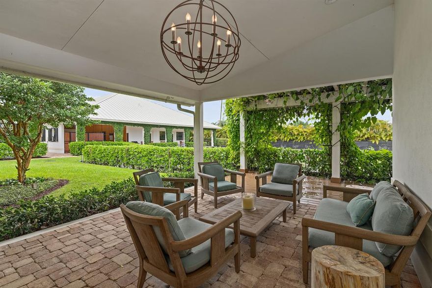 Like a beautiful gem, this swank farm located on the bridle path, just a 5 minute walk from the horse show is a rare find! New barns built in 2016 featuring 13 Röwer and Rüb stalls, two beautiful tack rooms, two feed rooms, laundry and office overlooking the 100' x 200' GGT arena. Custom 2/2 owner's house with chic furnishings, oversized master suite, chef's kitchen, office and dining area. Spacious wrap around outdoor entertainment area overlooking the stable and arena. Adjacent beautifully appointed 2/1 staff house with full kitchen, plenty of parking, four well sized paddocks and luscious landscaping complete this fabulous property. This is a great find for the most discerning and well traveled equestrian. Truly unique!