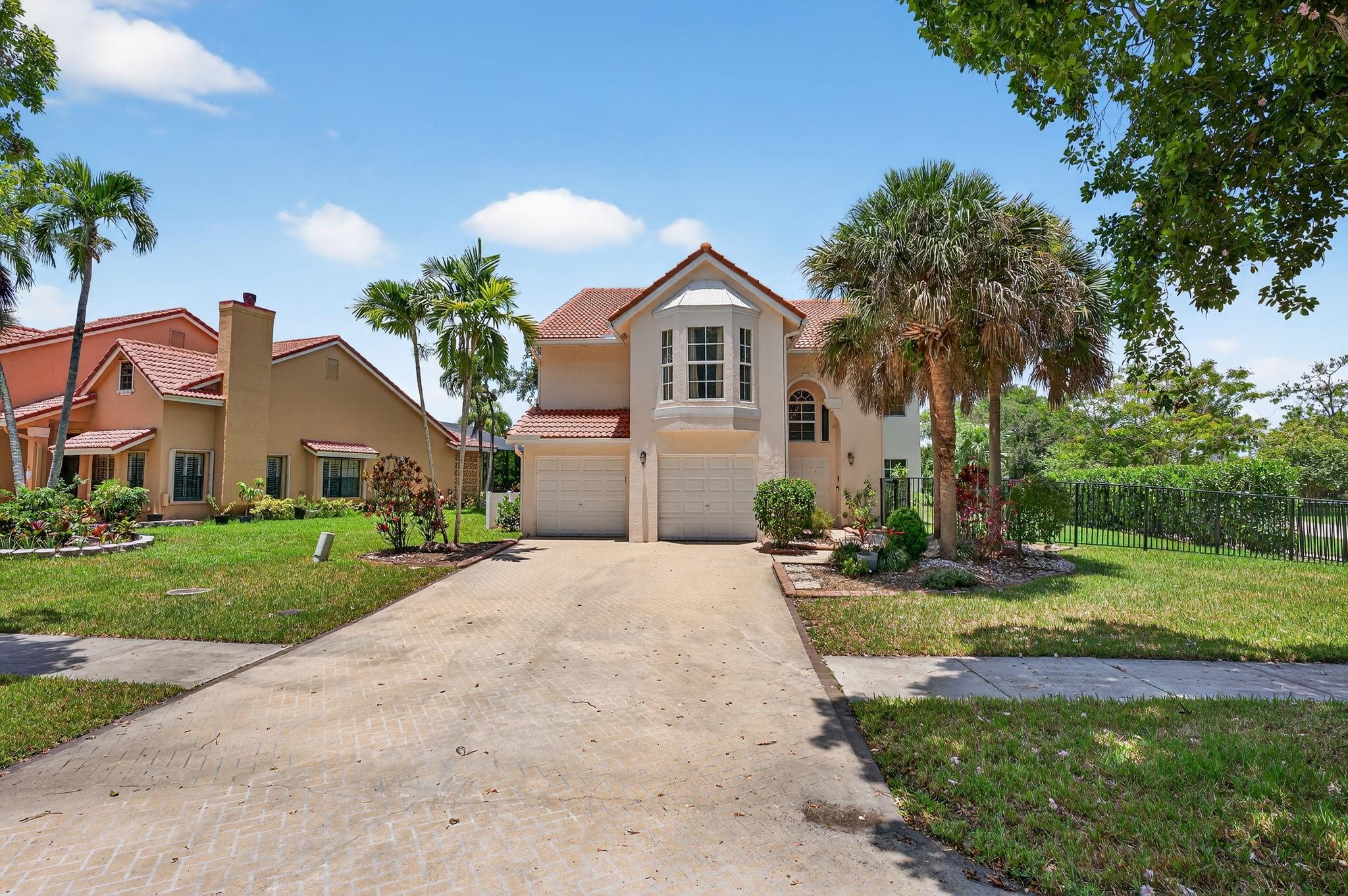 Welcome to Sable Pass, a gated community in Parkland. This 3BR/2.5BA home features a recently renovated kitchen with stainless steel appliances, dual wall ovens, built-in microwave, induction cooktop, wine fridge, and dishwasher. The main level includes a powder room, living room, family room overlooking the pool, open kitchen, dining area, and a cozy seating area with a wood-burning fireplace. Upstairs offers an open loft with built-in cabinetry—ideal as an office or potential 4th bedroom. The primary suite features high ceilings, walk-in closet, and a bright bath with dual vanities, jacuzzi tub, and separate shower. Two guest bedrooms share a full bath. Additional highlights: laundry room, 2-car garage, 2-zone A/C, south-facing exposure, and great natural light throughout.