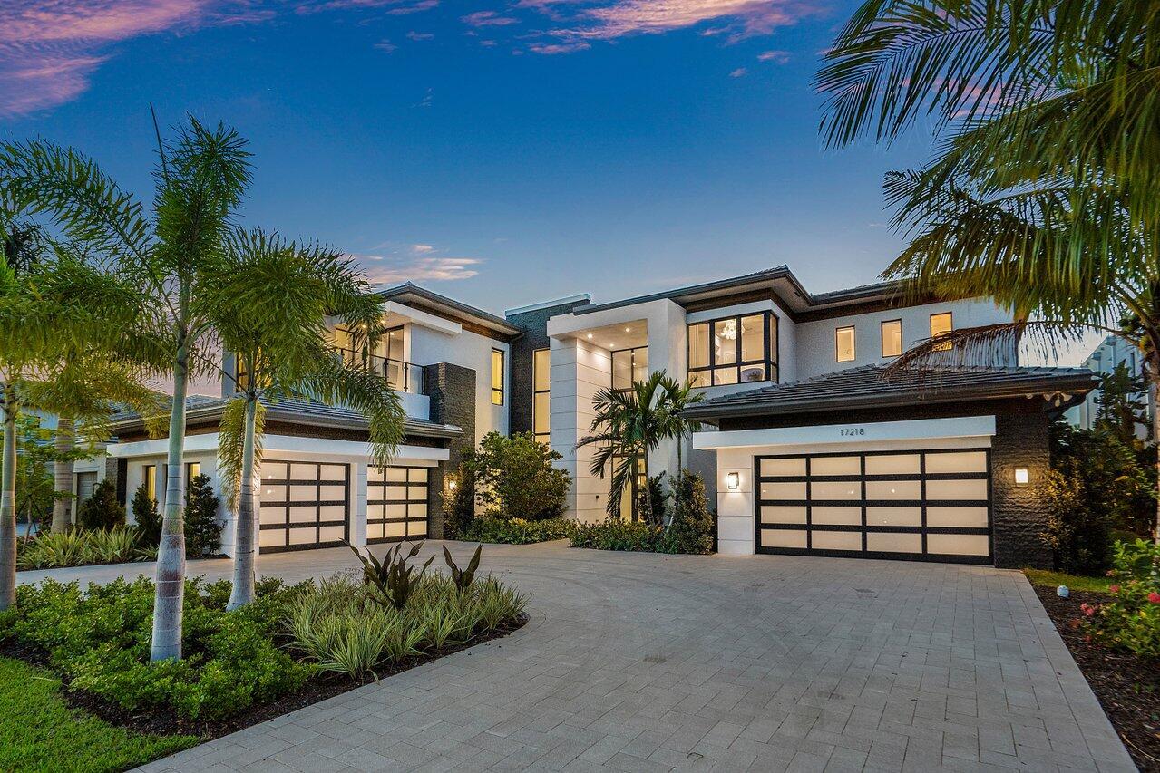 Set in prestigious Boca Bridges, this FULLY FURNISHED Vanderbilt Grand Contemporary is a modern architectural masterpiece. Situated on a lakefront property, this estate was elevated to a higher standard by Decorator's Unlimited and encompasses over $1.6MM of upgrades. This state of the art residence showcases unparalleled design with built-in custom cabinetry, double-sided water vapor fireplace, glass-enclosed wine room and customized audio/visual system. The backyard oasis hosts a resort-style pool and spa. A crafted contemporary design, a luxurious statement and a truly epic home. Luxury living is redefined at Boca Bridges where residents have access to resort amenities inclusive of a restaurant, beach entry pool, kids splash park, fitness center, tennis and pickleball courts.