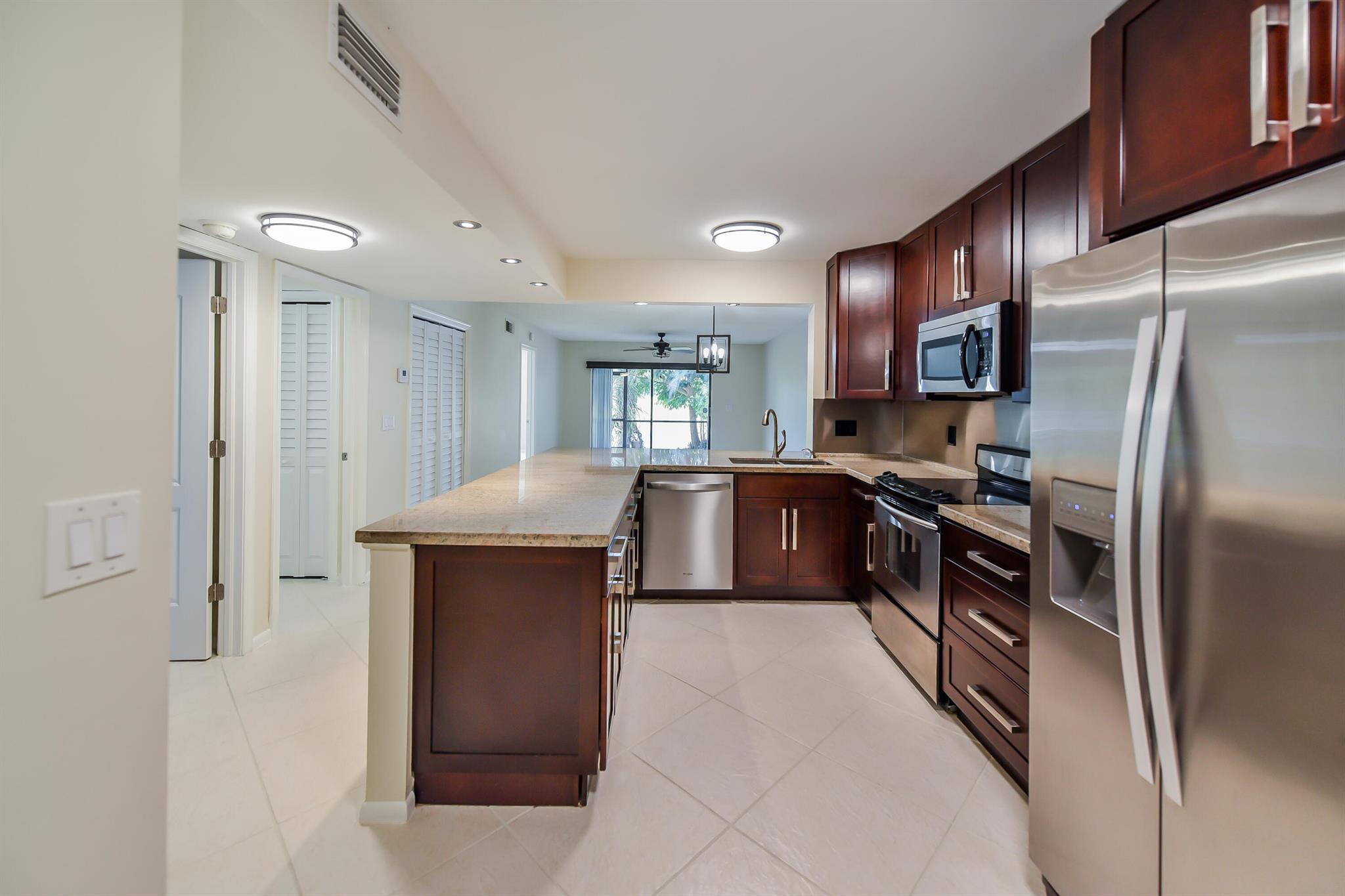 Presenting a charming 2-bedroom, 2-bathroom condo that is clean, updated, and move-in ready. This lovely unit has undergone recent renovations, featuring tile flooring throughout for easy maintenance. The kitchen showcases granite countertops and newer cabinets, accompanied by stainless steel appliances, providing a modern touch.Both bathrooms have been tastefully updated with contemporary fixtures, ensuring a fresh and inviting atmosphere. The bedrooms offer ample storage space with built-in closets, including a convenient walk-in closet in the master bedroom.With newer appliances including a washer, dryer, air conditioning unit, and hot water tank, this home is not only aesthetically pleasing but also functional and efficient.