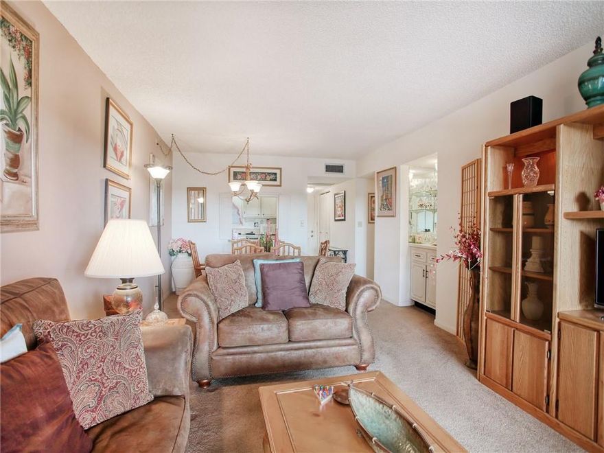 Exquisite 2/2 condo fully furnished with a private balcony with incredible views of pool and golf course. This unit features a large master suite with a dual closet and a large walk-in closet. Nice sized second bedroom. Plenty of space in the dining room/living room areas. Newer A/C and water heater in unit. This unit also has a washer and dryer. This is a great place where all ages are welcome. Plenty of convenient parking!