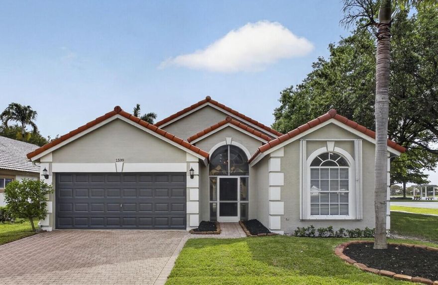 Fully renovated home in the Heart of Wellington. New Air Condition, Water Heater and Appliances 2026, Roof 2023. This home blends high-end designer finishes with the warmth of an organic aesthetic.  Slim shaker soft close birch cabinets with Pompeii quartz countertops. An explosion of natural light reflecting off stunning light oak luxury vinyl flooring. The airy, open-concept layout is punctuated by all-new recessed lighting. Both the Master and Secondary Bathroom have been completely renovated with porcelain tile, Moen brushed stainless fixtures, birch cabinets, Pompeii quartz and custom frameless shower enclosure.  Screeded-in Patio and Accordion Shutters on the exterior. A-Rated Schools, shopping and restaurants close by. Fully renovated clubhouse, walking and biking paths. Must see!