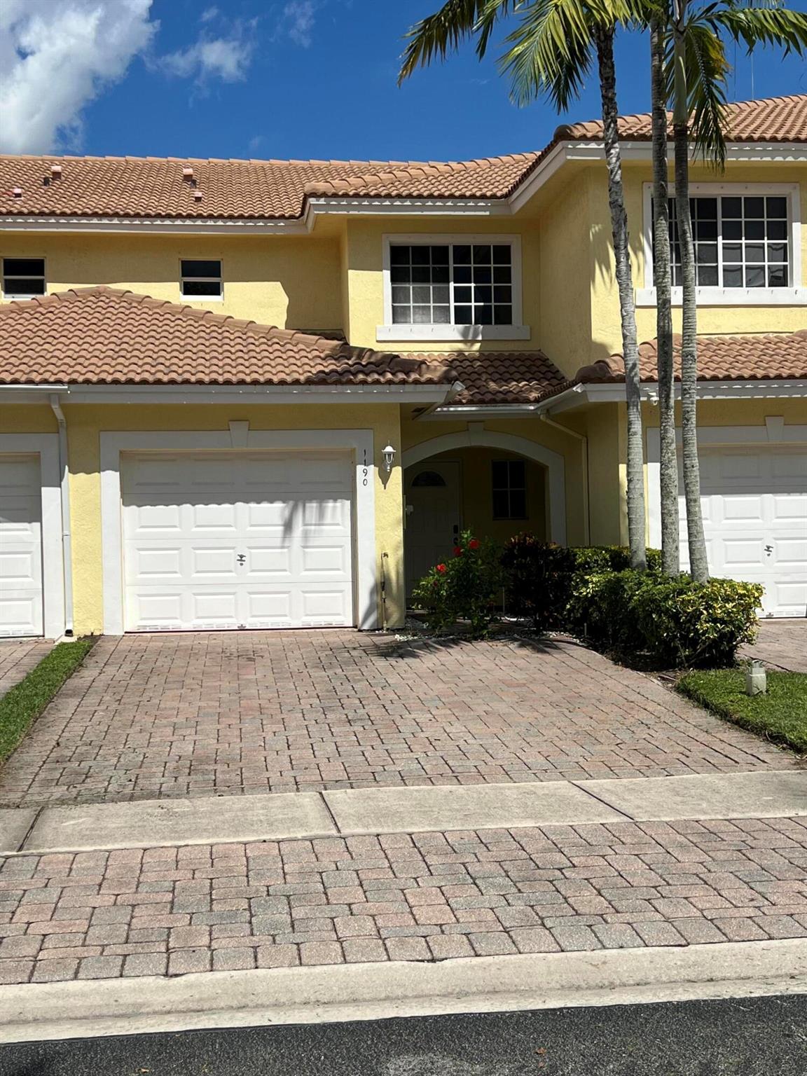 Updated Townhouse, Centrally located with ez access to Turnpike, SR80, I-95 and more. Lake views from almost anywhere. Gourmet kitchen setup with plenty of storage, stainless steel appliances. Tile flooring downstairs and vinyl flooring upstairs. Washer and dryer. freshly painted, new outlets throughout, new ceiling fans, 1 Car Garage and private driveway.
