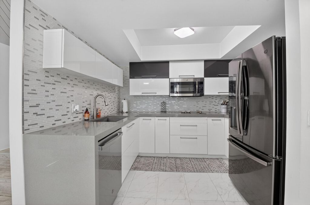 Photo of 4310 Village Drive #D, Delray Beach, FL 33445 (MLS # B26015133)