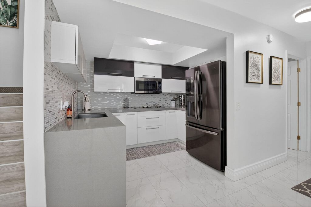 Photo of 4310 Village Drive #D, Delray Beach, FL 33445 (MLS # B26015133)