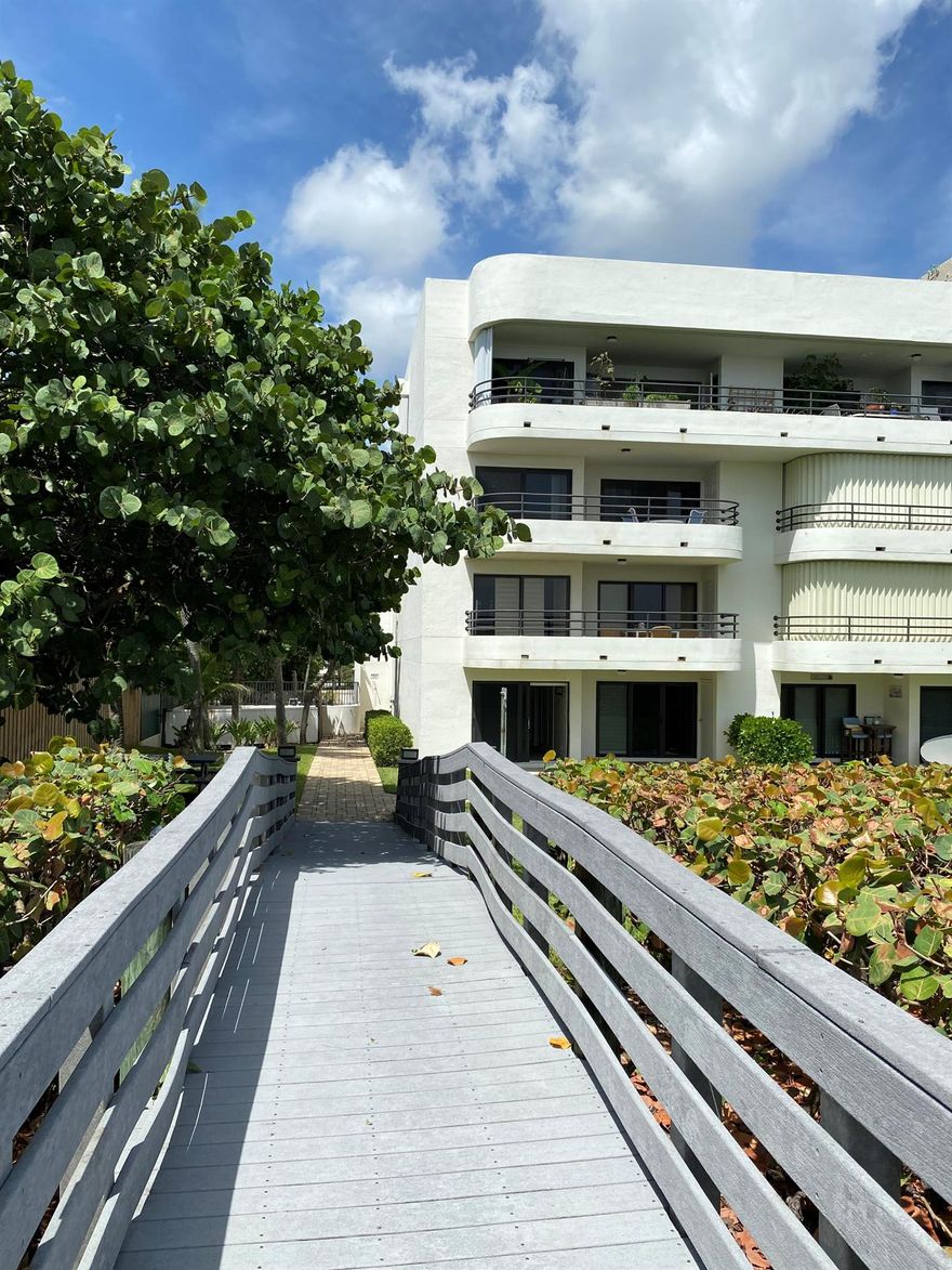 Walk out your back door directly onto the beach. This property is unfurnished. Enjoy tropical breezes and the serene sound of waves crashing from this 1st floor ocean end unit in Juno Shores. Impeccably renovated from floor to ceiling with the highest quality of materials. Updated kitchen cabinets, gorgeous marble countertops, upgraded appliances, wood look tile throughout, updated bathroom vanities, updated master shower, new water heater, Cool AC, and complete impact windows and sliders. No expense spared! This private 1st floor unit allows you to relax on your covered porch while watching the sunrise over the ocean, or walk steps to the beach on the private, community boardwalk. Juno Shores is a small, quaint complex. Minimum 1 year lease required.