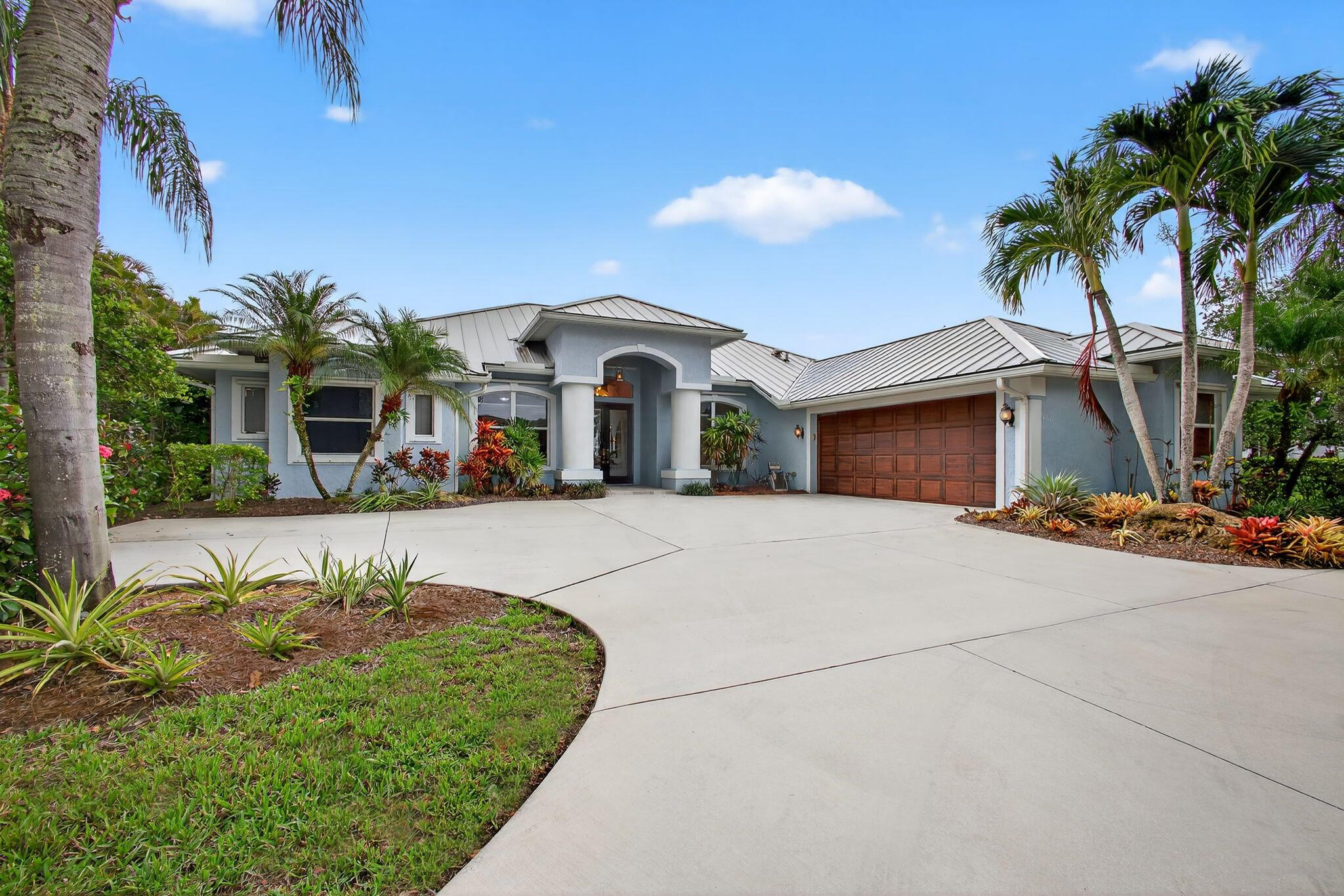 Amazing opportunity to own a home in Palm City's Lake Grove Estates with just 64 homes. Amazing 5 bed, 4 bath home in Palm City, on nearly 3/4 acre. Stunning new 32 x 32 porcelain tile flooring. Updated kitchen & baths. Formal dining, living; kitchen opens to family room. Triple split plan with privacy suite perfect for in-laws, grads or guests. Huge screened patio and beautiful heated pool and spa completely refurbished. Large open patio for firepit parties. Huge private backyard. Lush landscaping includes fruit and flowering trees. Metal roof in 2017. Circular driveway with ample parking, perfect for pulling your boat through. The gated community has a boat yard, pickelball, tennis and basketball. Fish in the lake off the pier. What an amazing property your entire family can enjoy!