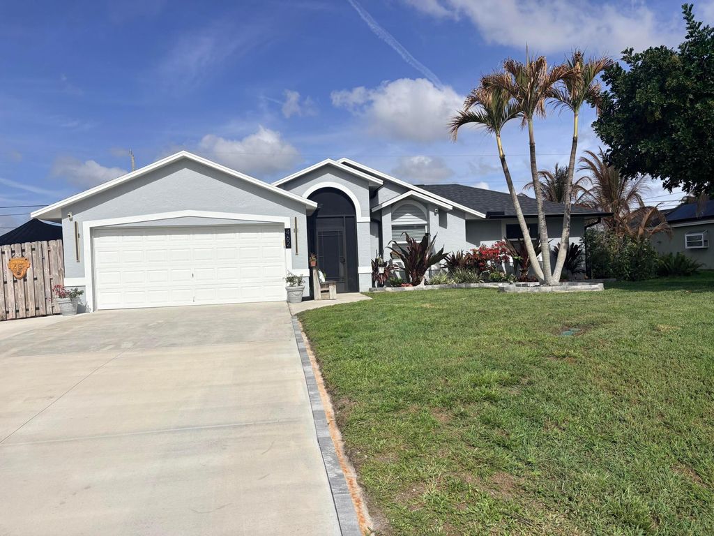 Photo of 462 SE Cork Road, Port Saint Lucie, FL 34984 (MLS # B26005316)