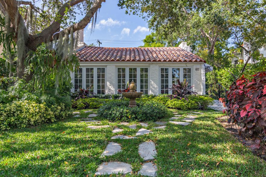 Stunning Flamingo Park Jewel Box! Meticulous renovation brings modern amenities to this 1920s Spanish Style residence. The home opens up to a light filled sunroom clad with Pecky Cypress throughout. Living room boasts soaring 14' vaulted ceilings and restored hardwood floors, effortlessly blending new with old world charm. The formal dining area leads to the expansive kitchen with fine details from handmade backsplash tiles to high-end Thermador appliances. Bedrooms feature Sanderson wallpaper, thoughtful built-ins, & bright windows fusing indoor and outdoor living. The yard houses the guest cottage with full bath & kitchenette. Stone pathways leading through the grounds are flanked with tropical and mature landscaping accentuated by dramatic uplighting epitomizing South Florida living!