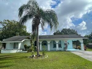 This 4-bedroom, 2-bathroom pool home with a carport boasts new Vinyl Flooring and tile flooring throughout. It features separate living and dining areas, a kitchen with a gas stove, and a generously sized master bedroom. The second bedroom has a sliding glass door that opens to a small, private covered patio. Both the dining and living rooms provide access to a covered patio overlooking the pool and a sizable fenced yard. Additionally, there is a separate laundry room with a storage area. The property is connected to city water and sewer services and includes gas for the hot water heater and stove. The pool equipment is relatively new, and the gas hot water heater is about one year old. With its numerous features, this property holds great potential