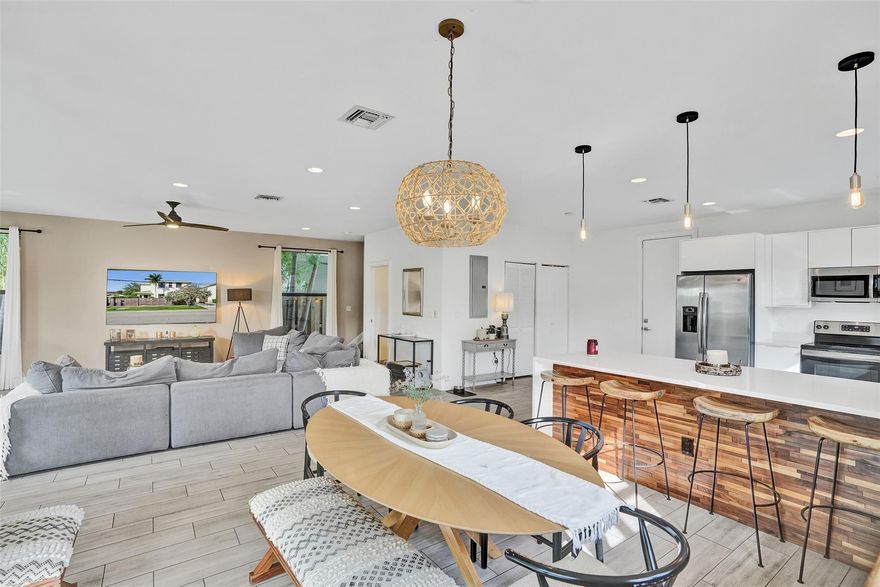 Beautiful fee-simple townhouse with no HOA, offering 3 bedrooms, 2.5 bathrooms, impact windows and doors, high ceilings, and 2,130 sq ft of modern living. Built in 2018, the home features an open layout with a stylish kitchen, modern white cabinetry, quartz countertops, a large island, and excellent storage, including a pantry. Upstairs, the bedrooms are bright and comfortable. The primary suite offers a spacious feel with a large walk-in closet and a double-sink vanity. Enjoy a private, fully fenced patio ideal for relaxing or entertaining. Additional features include a one-car garage, private driveway, and abundant storage. Excellent location near Downtown Fort Lauderdale, Las Olas, Flagler Village, parks, shopping, and the beach. Priced below market value. Interior freshly painted.