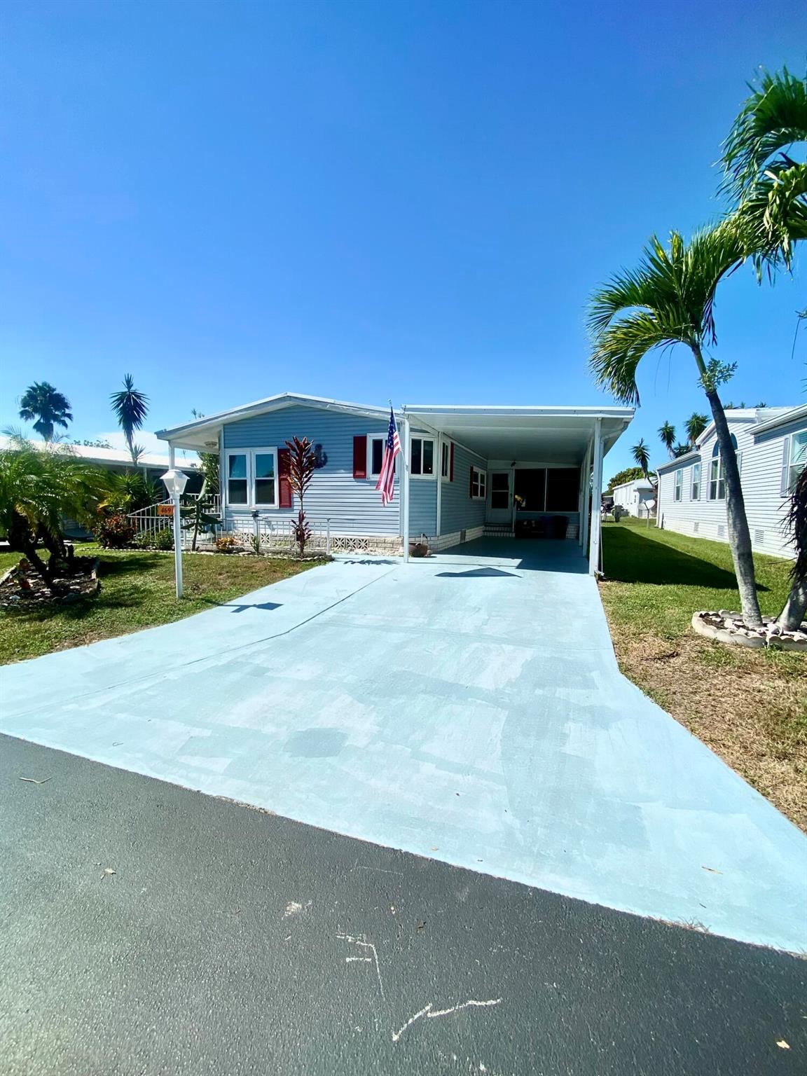 Come by and see this gorgeous 2-bedroom, 2-bath manufactured home in Tropical Isles, a beautiful 55+ community located in Fort Pierce. The first thing you'll notice is the bright & brand new Lifeproof luxury vinyl plank flooring with ample counter space and a custom pantry with an eat-in dinette. The home features a spacious & open living room with vaulted ceilings and a dining area offering plenty of space for both entertaining and everyday living. The master bedroom is beyond spacious, and has a very large and roomy master bathroom while the guest bath has a stunning full-sized skylight! Hurricane windows throughout and comes with a brand new generator to boot! Come make this house your home!
