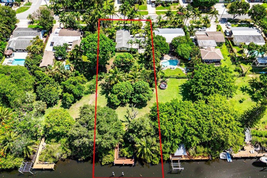 Build Your Dream Home on This Rare Oversized Waterfront Lot in the Heart of North Palm Beach! Situated on a generous 150' x 100' lot with a unique additional easement (approx. 126' x 100'), this property offers unmatched space and potential. An extra 25 feet of width sets it apart from neighboring lots, making it ideal for expansive outdoor living, a custom-designed pool, or future redevelopment. Currently, the property features a charming 3-bedroom, 2-bath home with a split floor plan, a spacious eat-in kitchen, adjacent living room, and a detached 1-car garage--perfect for those looking to renovate or rebuild. Enjoy 100 feet of waterfront on the Earman River with direct ocean access--a boater's dream. The home comes with a newer 27' x 6' composite dock, capable of accommodating up to ...