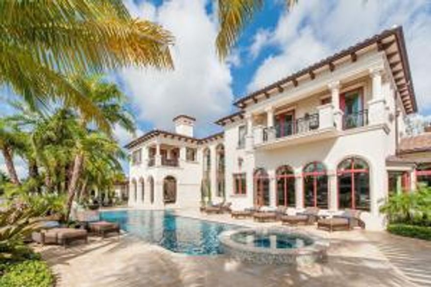 Opulence abounds from the first glimpse of this architectural masterpiece in The Sanctuary of Boca Raton. Absolutely stunning, this custom built home is nearly 16,000 square feet of exquisite craftsmanship from the grand rooms of the main house to the resort-style pool and immaculate landscaping down to the smallest details that extend to the guest home. A home like this must be set to a backdrop just as breathtaking and The Sanctuary delivers. Approaching the home, surrounded by well-manicured, lush, tropical landscaping and blanketed by trees over 50' high, tumbled charcoal pavers welcome you to the entrance and garage area.