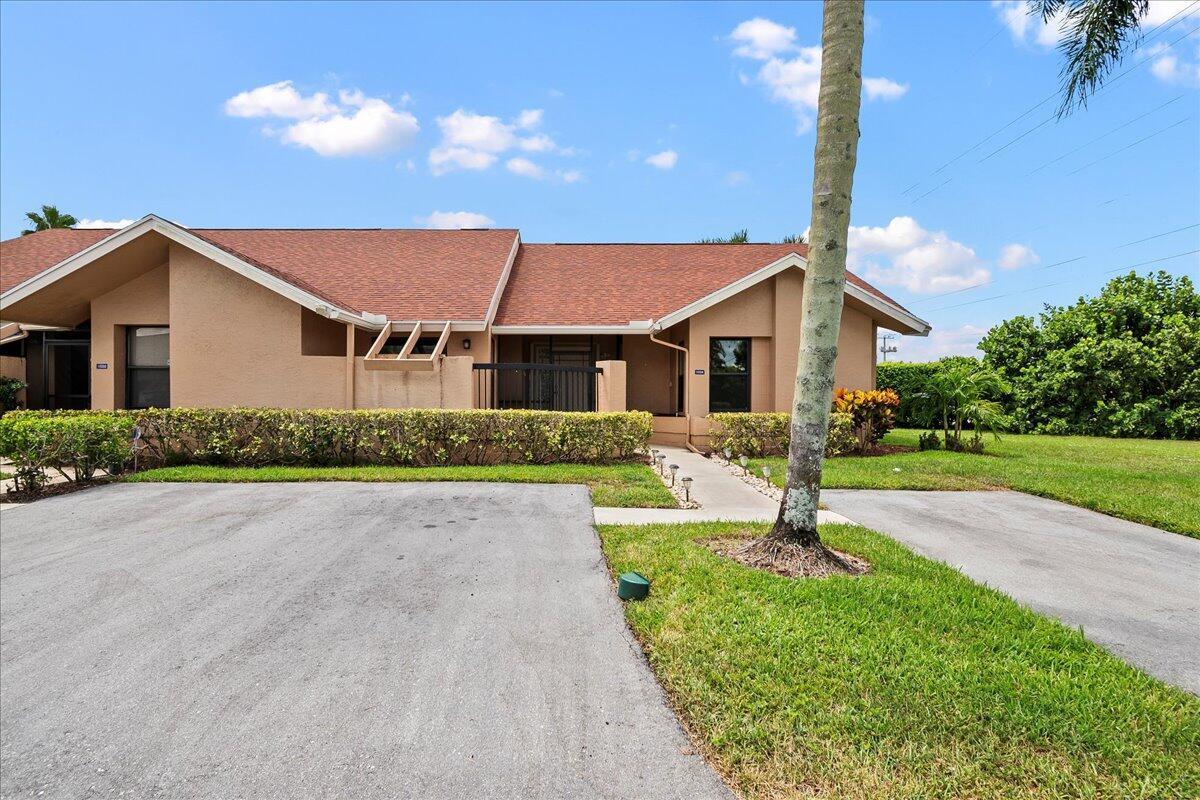 Welcome to carefree living in this beautifully maintained 2-bedroom, 2-bath villa located in sought after Waterberry of Boca Chase, a 55+ community! This move-in ready home features a new roof and accordion shutters for peace of mind and storm protection. Freshly painted throughout, the villa offers a bright and welcoming interior with spacious living areas and plenty of natural light. Enjoy extra square footage in the fully air-conditioned patio, perfect for a den, hobby room, or relaxing sunroom. Situated on an oversized corner lot, this villa offers added privacy, outdoor space, and curb appeal. With thoughtful improvements and excellent upkeep, this home is ready for you to move in and start enjoying the low-maintenance lifestyle in a welcoming and active adult community.