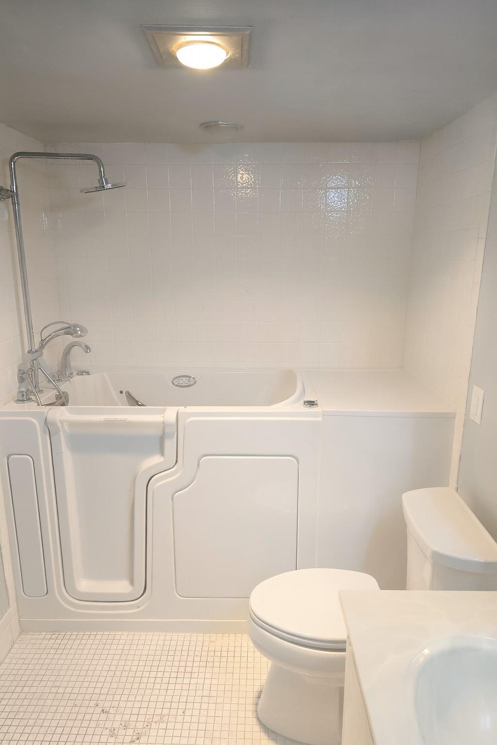 Welcome to Wynmoor, Coconut Creek’s premier 55+ community! This spacious 2-bedroom, 2-bath condo has been freshly painted and features a premium walk-in tub—perfect for comfort, safety, and peace of mind. Conveniently located next to the elevator and laundry room, the unit offers a spacious layout with plenty of natural light, an updated enclosed balcony for relaxing, and convenient access to community amenities. Wynmoor offers resort-style living with pools, a fitness center, golf, a theater, pickleball, and endless social activities. Ideal for those seeking a vibrant lifestyle with added safety features, this home blends comfort with convenience. Don’t miss your chance to live in a secure, active-adult community close to shopping, dining, the beach, and major highways!