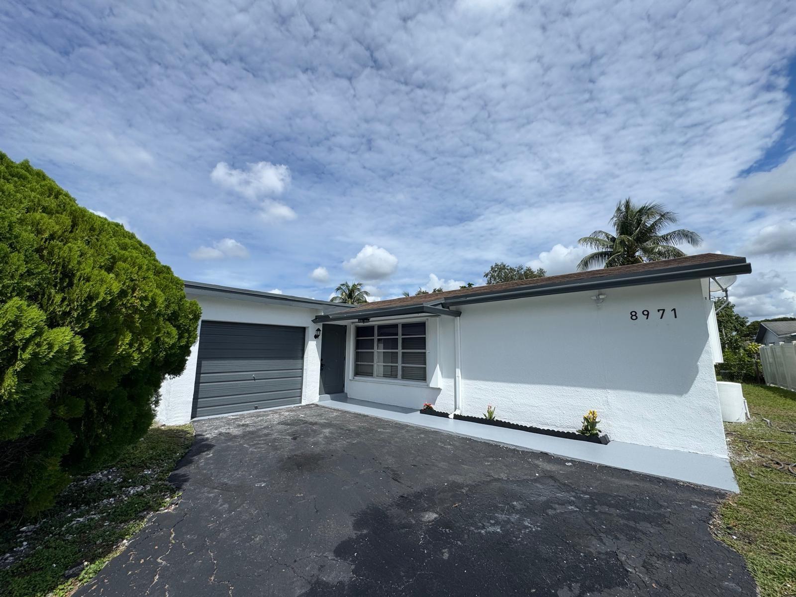 Beautiful Move in Ready 3 bed 2 bath plus a family room and 1 car garage| Room for a 4th Bedroom | NO HOA | Split Floor plan | Property Features European Designer Style Kitchen with Quartz Countertops and New Stainless Steel Appliances plus new Washer and Dryer | New flooring throughout | Oversized fenced back yard with fruit trees | Accordion Shutters | Highly sought after area of Pembroke Pines | Conveniently located close to Pembroke Mall | Hospitals | Shopping | Dining | Entertainment.