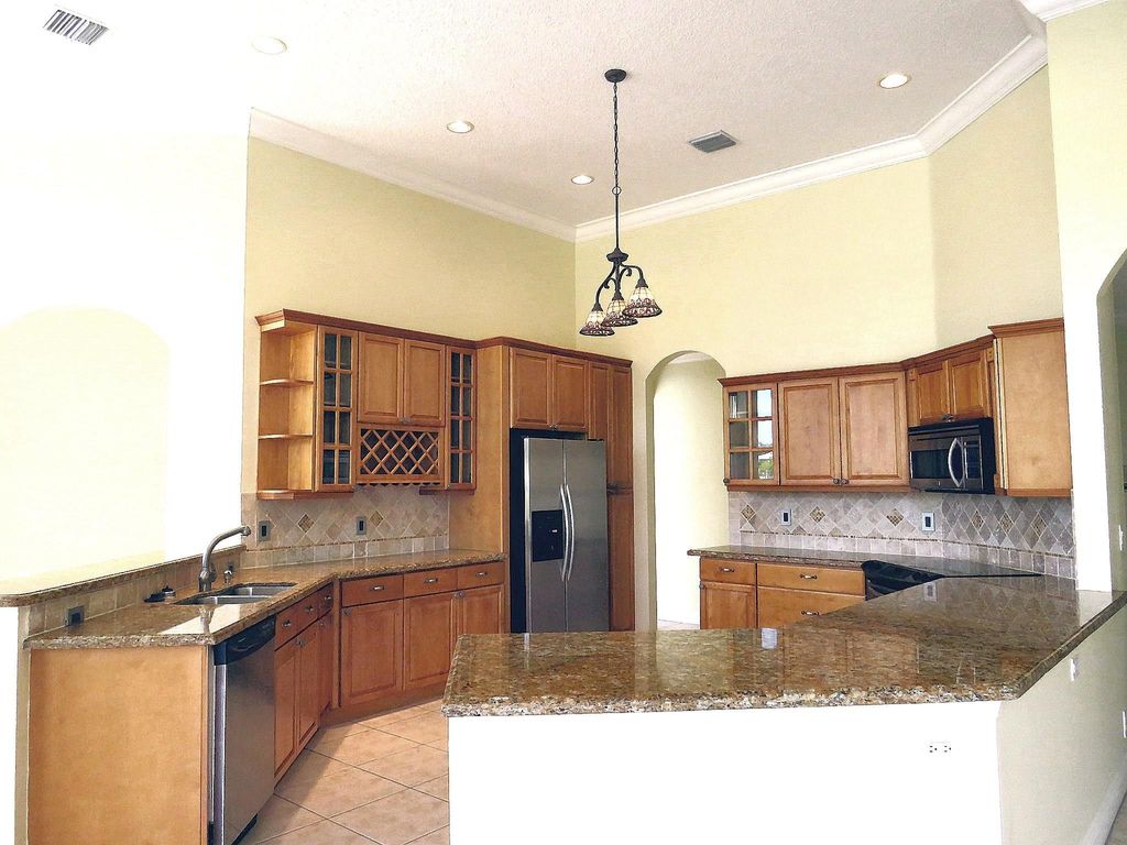 Photo of 5911 NW 63rd Place, Parkland, FL 33067 (MLS # F10414295)