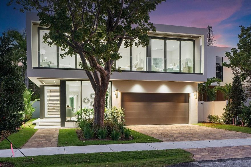 New construction architectural masterpiece in Rio Vista, Fort Lauderdale, where modern design meets luxury living. This 4,700 SF home showcases an innovative layout with a central pool as its focal point, surrounded by vast glass walls that blend indoor and outdoor spaces. The open floor plan is highlighted by a gourmet kitchen with high-end appliances and full smart home features including a built-in speaker system. Five bedrooms and five bathrooms provide ample space for family and guests. Unique elements include an accent wall along the atrium below the floating custom walnut staircase. Built with a solid concrete roof, this home offers exceptional durability and style. The expansive backyard is perfect for Florida's outdoor lifestyle. Just minutes from the beach and the vibrant LasOlas