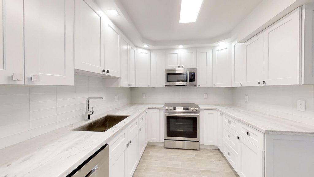 Photo of 3980 Oaks Clubhouse Drive #407, Pompano Beach, FL 33069 (MLS # B26018258)