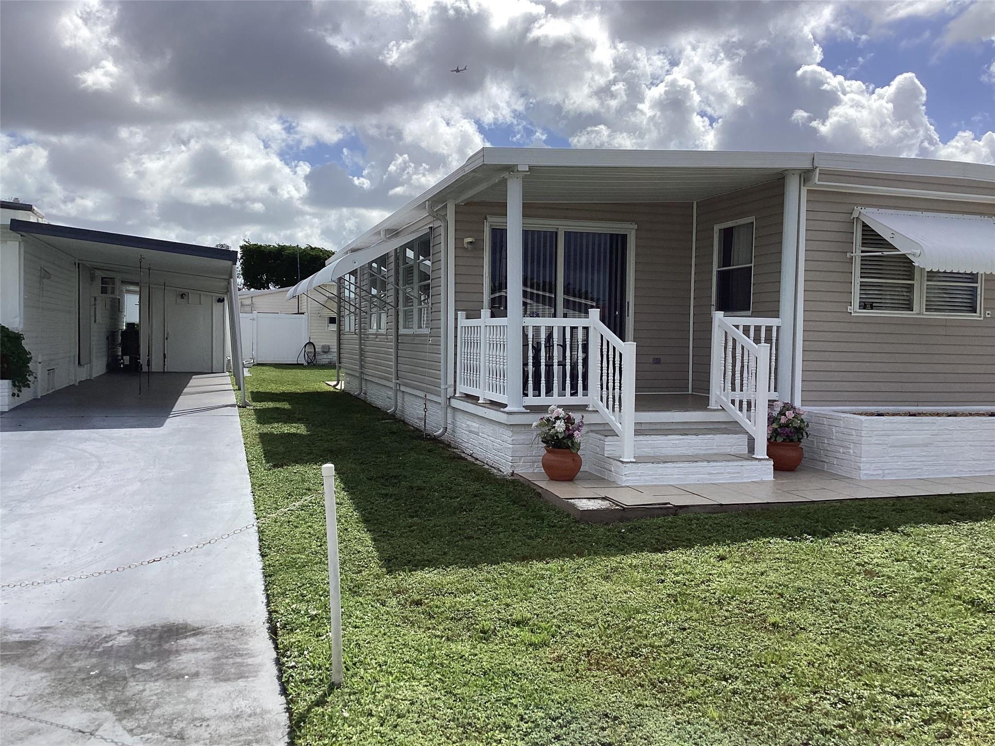 Absolutely stunning 3/2.5 split bedroom plan - -beautiful flooring through out - shower is in the shed - house is 3/1.5 plus shed shower - -updated gorgeous bathroom - -Florida room - open porch plus screened in porch as well - -super clean - Really nice - -assoc. states it is HOPA verified - -priced right for quick sale - -great curb appeal - -truly a must see......... Buyer must sign FRPTA addendum - nice size home and lot in Sec 2...