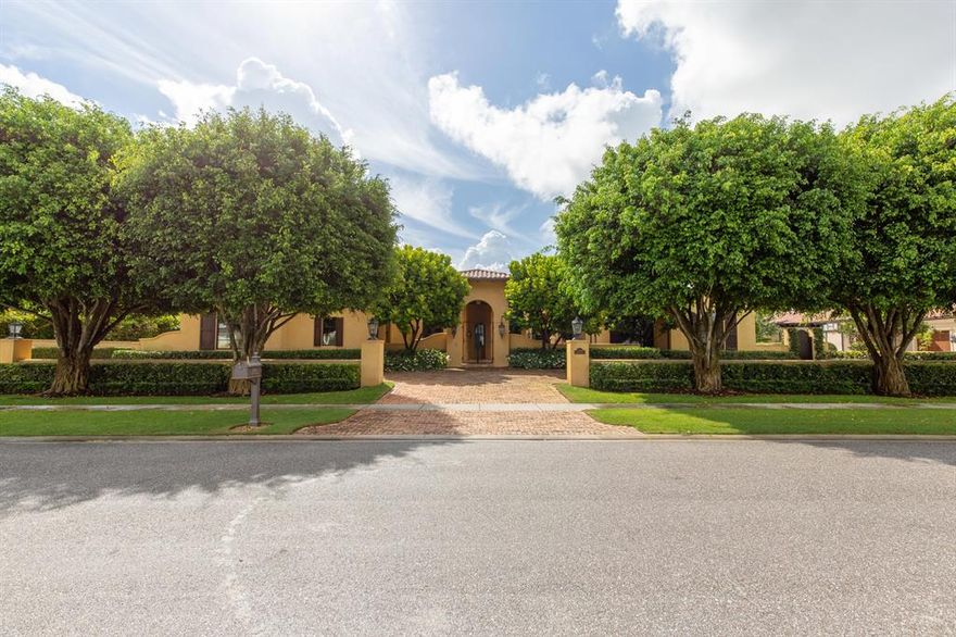 Elegant waterfront estate located in the exclusive Cypress Island of Palm Beach Polo, boasts 4 bedrooms, 6 and one half baths, 3 car garage and just under 6,000 square feet of living space. Reminiscent of a true Tuscan villa, this luxury home makes a grand impression with a courtyard entrance, soaring coffered ceilings, beautiful wide plank wood floors, and an abundance of natural light from large windows and French doors. The open floor plan boasts a state-of-the-art chef's kitchen, an airy dining room with attached rustic wine room, and a great room with a floor to ceiling stone fireplace and 3 sets of French doors leading out to the covered patio and pool area.