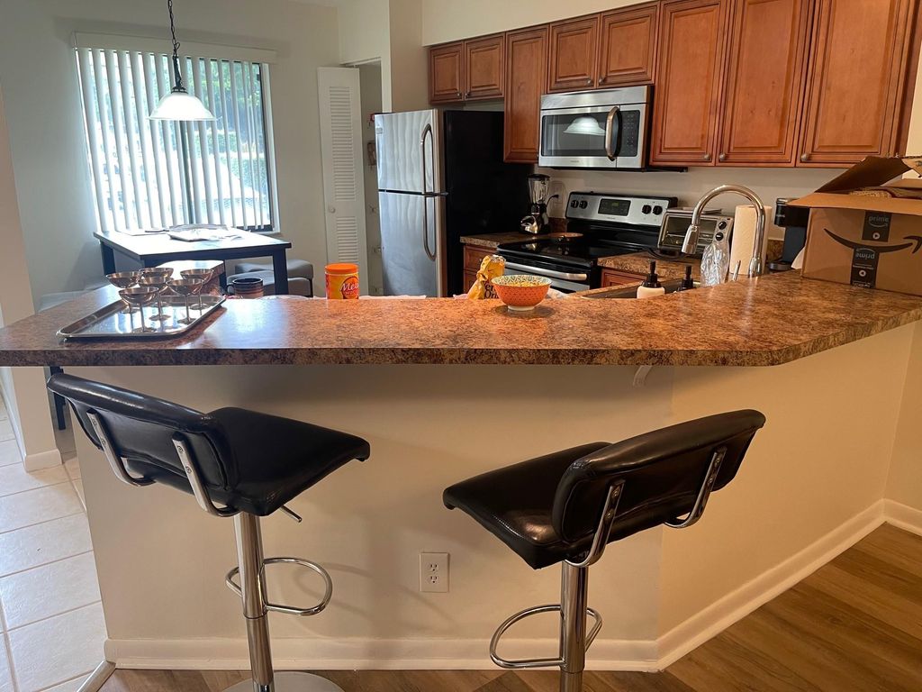 Photo of 2205 S Cypress Bend Drive #106, Pompano Beach, FL 33069 (MLS # F10497053)
