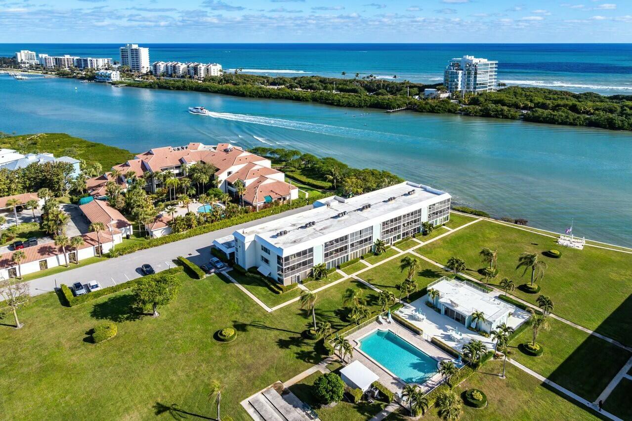 Experience the epitome of luxury coastal living in this stunning 2 bed, 2 full bath split floor plan condo located on the top floor of the highly sought-after Waterway Beach Condos in Tequesta, Florida. This elegant corner unit offers breathtaking panoramic views of the intracoastal and pool, providing a tranquil and picturesque setting for your ultimate relaxation.This fully furnished turnkey condo boasts a tasteful coastal decor, creating an inviting and luxurious atmosphere. The remodeled interior features high-end finishes and modern amenities, ensuring a comfortable and upscale living experience.Unwind after a long day on your private screened-in patio, perfect for enjoying the gentle ocean breezes and entertaining guests. The condo also offers convenient access to the community