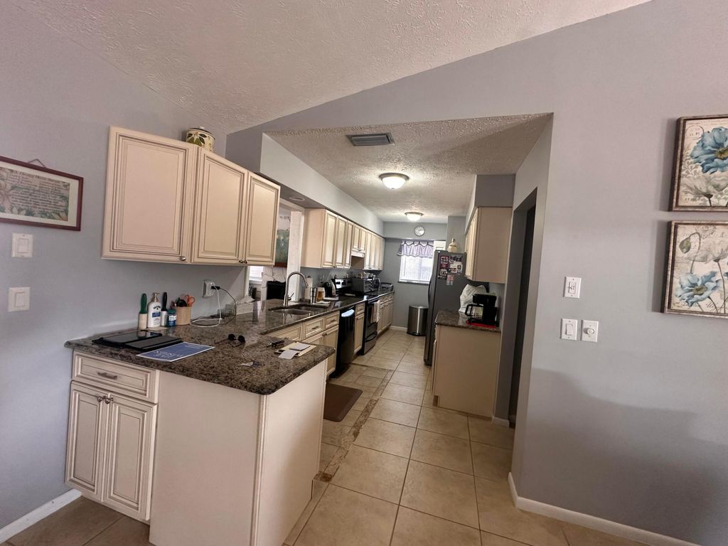 Photo of 119 SW Fairchild Avenue, Port Saint Lucie, FL 34984 (MLS # R11165205)