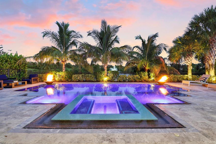 Waterfront, entertainer's paradise in the highly sought after community of Sonoma Isles! This 6 bedroom, 5 1/2 bath professionally decorated, former model home features a 1st floor extended primary bedroom complete with sitting area, spa like tub & walk in closet. Stainless appliances, gas range, wet bar and a formal dining room are just a few of the features in this stunning home! The 2nd story has 3 en-suite guest rooms, a loft living/entertaining area, theater room, wet bar & mini fridge. Unique decorator features throughout!Enjoy beautiful sunrises & sunsets from your back patio. This tropical oasis is complete with a summer kitchen,  heated pool & spa.Located in a gated community with a resort style pool, tennis, gym, & so much more!Close to 95 & the turnpike for easy acces