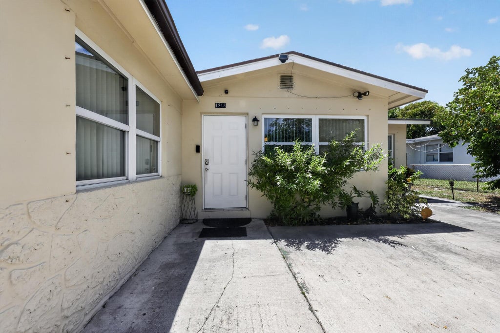 Photo of 1213 14TH Avenue S, Lake Worth Beach, FL 33460 (MLS # B26068937)