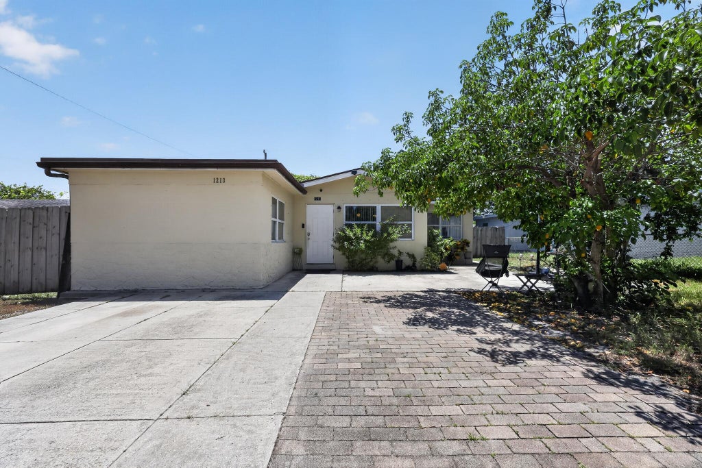 Photo of 1213 14TH Avenue S, Lake Worth Beach, FL 33460 (MLS # B26068937)