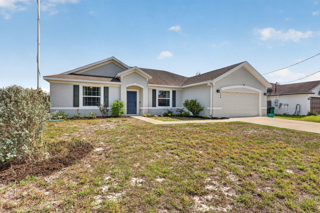 Photo of 770 SW Saragossa Avenue, Port Saint Lucie, FL 34953 (MLS # B26032912)