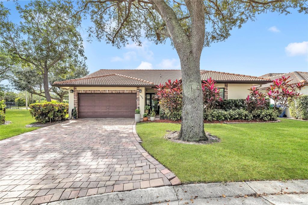 Photo of 10940 Cypress Run Cir, Coral Springs, FL 33071 (MLS # F10536005)