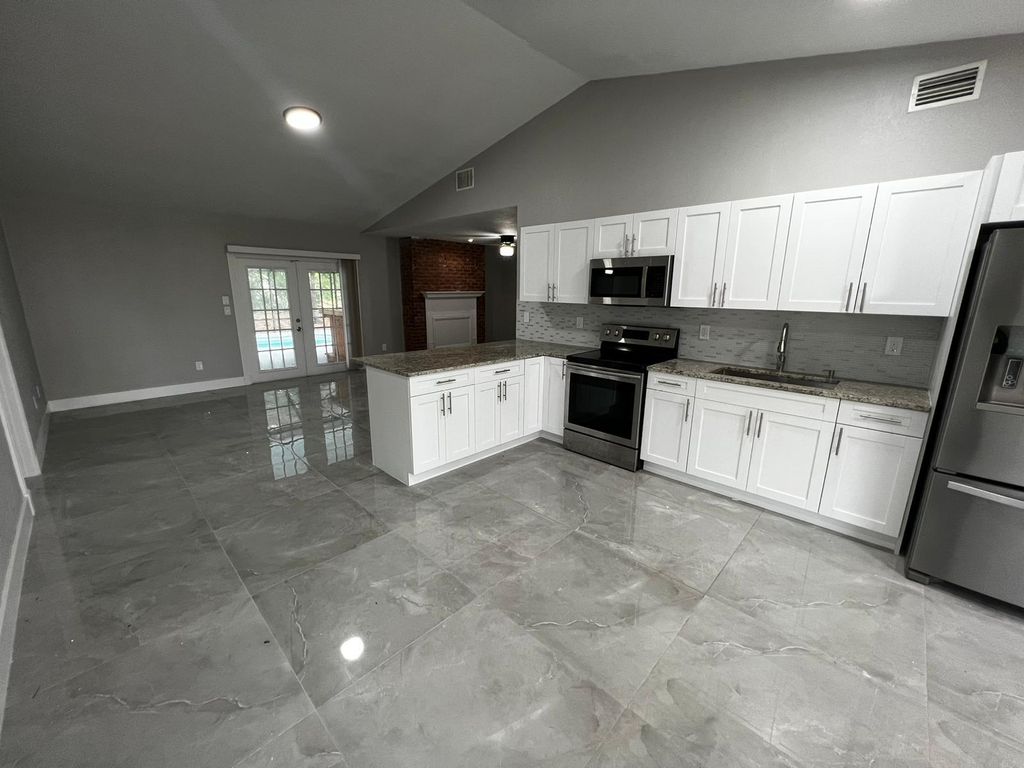 Photo of 1310 SW Bellevue Avenue, Port Saint Lucie, FL 34953 (MLS # R10963823)