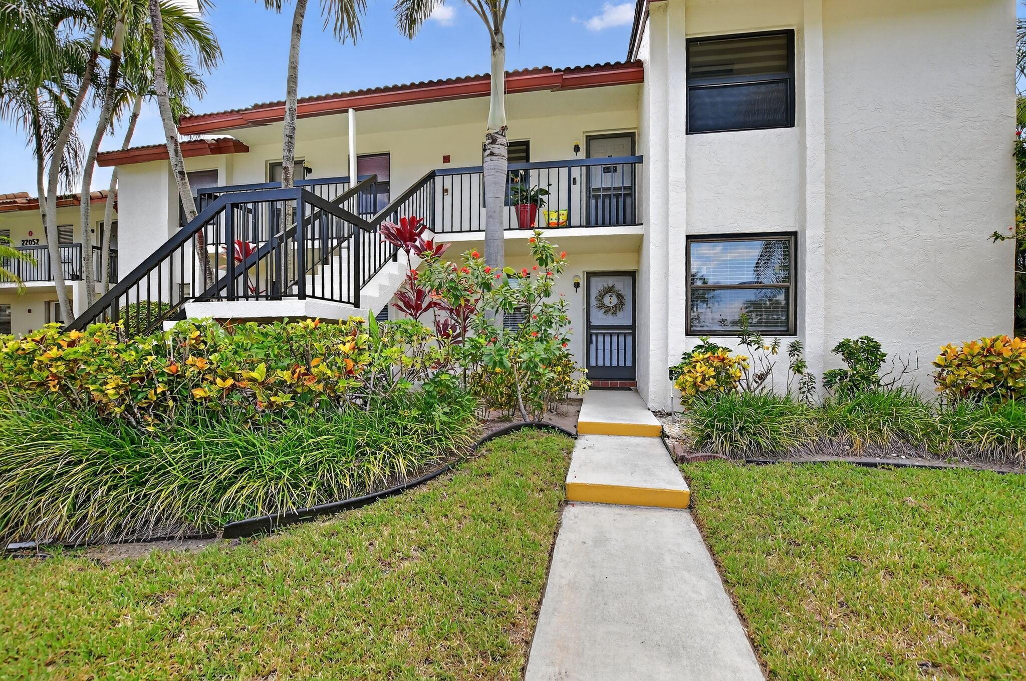 Rarely available, oversized 1st-floor corner unit in Boca Palms, ideally located in the heart of Boca Del Mar! This 2-bed, 2-bath condo is freshly painted and features new vinyl flooring, modern baseboards, and an indoor laundry room. Enjoy a spacious layout with two generously sized bedrooms, including a primary suite with updated ensuite and both baths offering walk-in showers. Relax on the screened patio with extra storage. Assigned parking, community pool and spa. Prime location near shopping, dining, highways, places of worship, and less than 5 miles to the beach. A-rated schools. Low quarterly fees includes roof maintenance, water, cable & exterior building insurance.