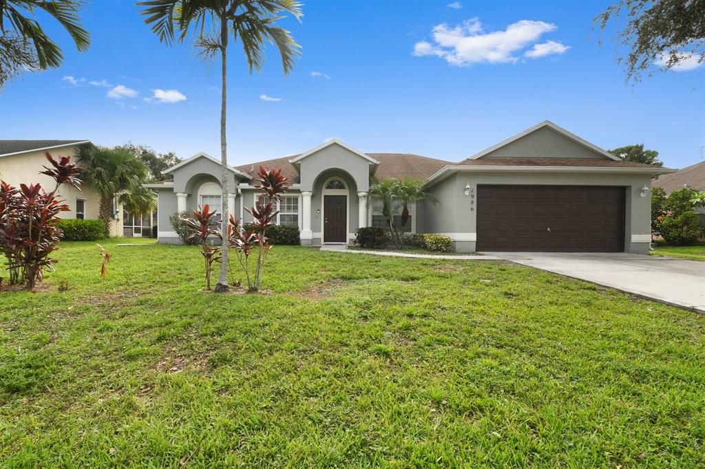Photo of 1986 SW Davis Street, Port Saint Lucie, FL 34953 (MLS # R10741181)