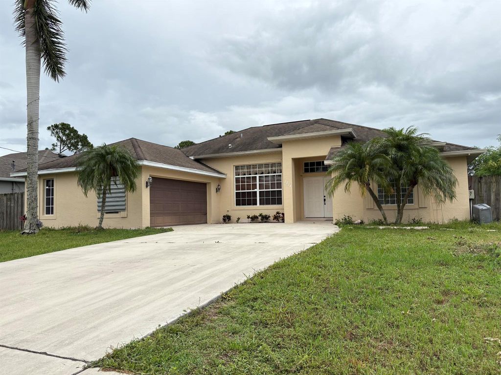 Photo of 1214 SW Emerald Ave, Port St Lucie, FL 34953 (MLS # R11096466)