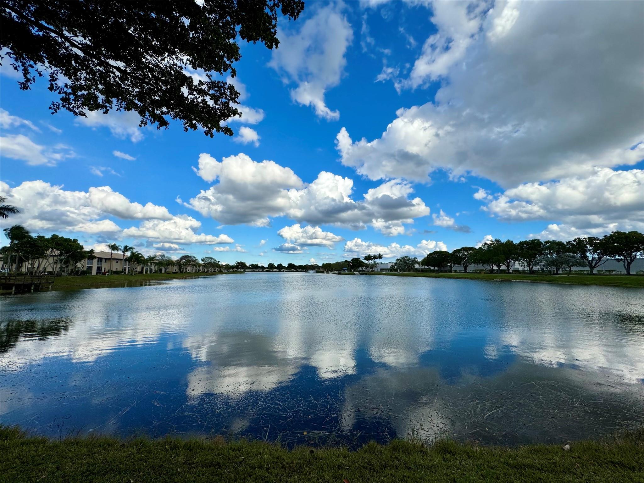 JUST REDUCED!! YOUR SEARCH IS OVER! ENJOY BEAUTIFUL LAKE VIEWS RIGHT FROM YOUR LIVING ROOM & SCREENED PATIO. FIRST FLOOR UNIT. TILE FLOORS THROUGHOUT. WOOD KITCHEN CABINET DOORS & GRANITE COUNTERTOPS. UPDATED BATHROOM VANITIES. PROPERTY SOLD AS IS. RANGE, WASHER & DRYER ARE EXCLUDED FROM THE SALE. REFRIGERATOR WATER DISPENSER IS INOPERABLE. RELAX AT THE COMMUNITY POOL WHICH IS ALSO LOCATED ON THE LAKE. GATED COMMUNITY. NO LEASING ALLOWED. MINIMUM OF 5% DOWN PER ASSOCIATION. VIEWPOINTE IS LOCATED WITHIN WALKING DISTANCE TO RESTAURANTS, SHOPPING & MORE. HURRY BEFORE THIS GEM IS GONE!