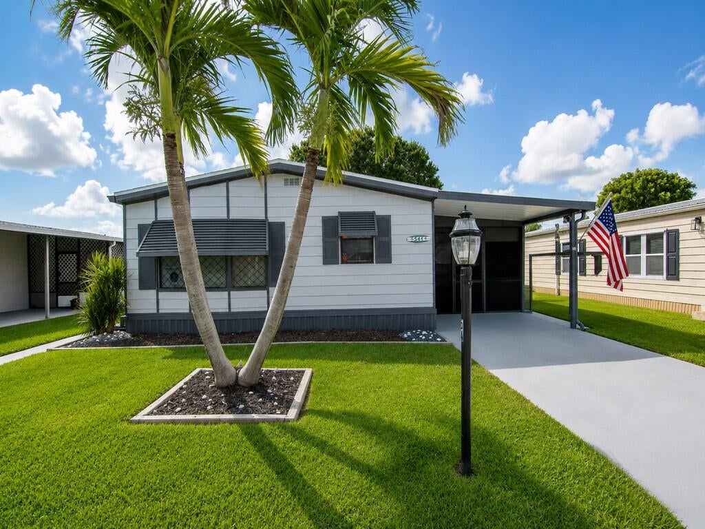 Photo of 541 Barb Ann Lane, Port Saint Lucie, FL 34952 (MLS # B26071106)