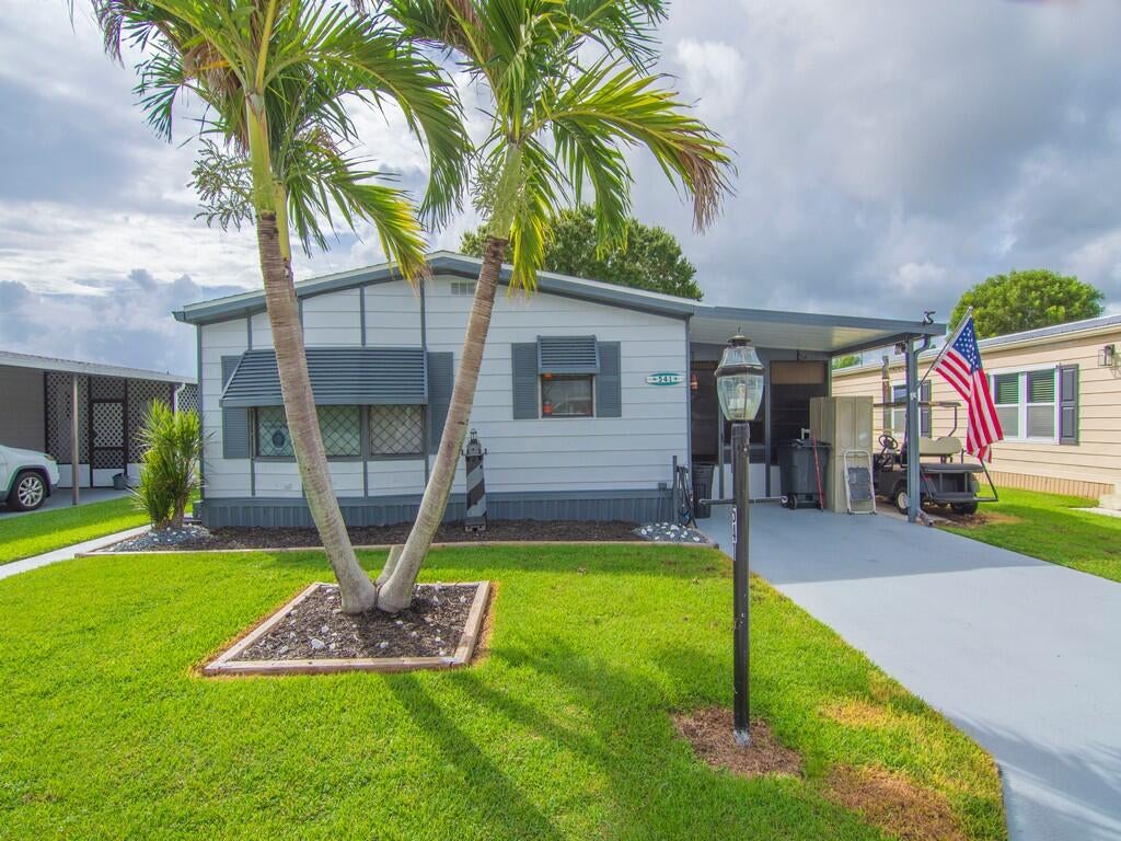 Photo of 541 Barb Ann Lane, Port Saint Lucie, FL 34952 (MLS # B26071106)