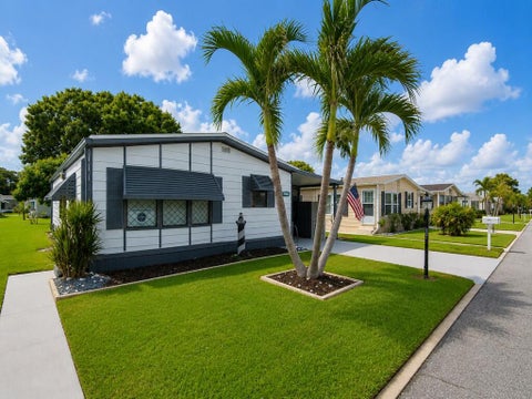 Photo of 541 Barb Ann Lane, Port Saint Lucie, FL 34952 (MLS # B26071106)