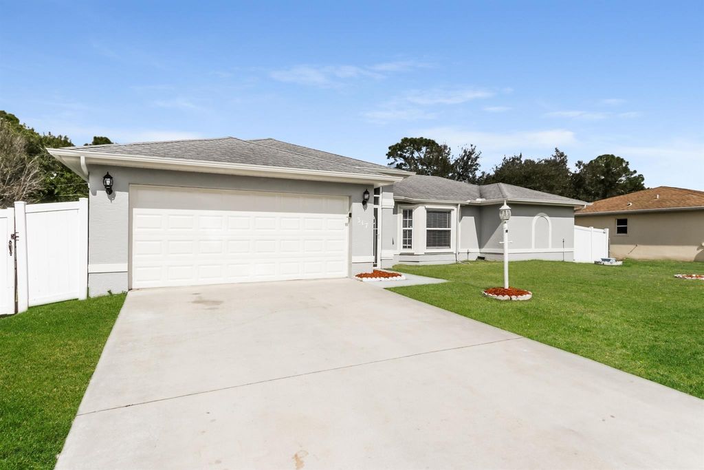 Photo of 317 SW Duxbury Avenue, Port Saint Lucie, FL 34983 (MLS # R11116862)