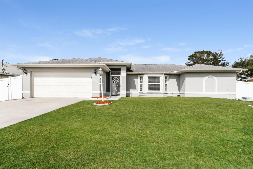Photo of 317 SW Duxbury Avenue, Port Saint Lucie, FL 34983 (MLS # R11116862)