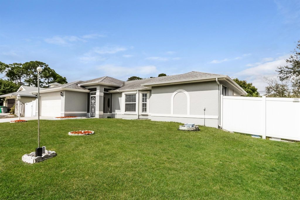 Photo of 317 SW Duxbury Avenue, Port Saint Lucie, FL 34983 (MLS # R11116862)