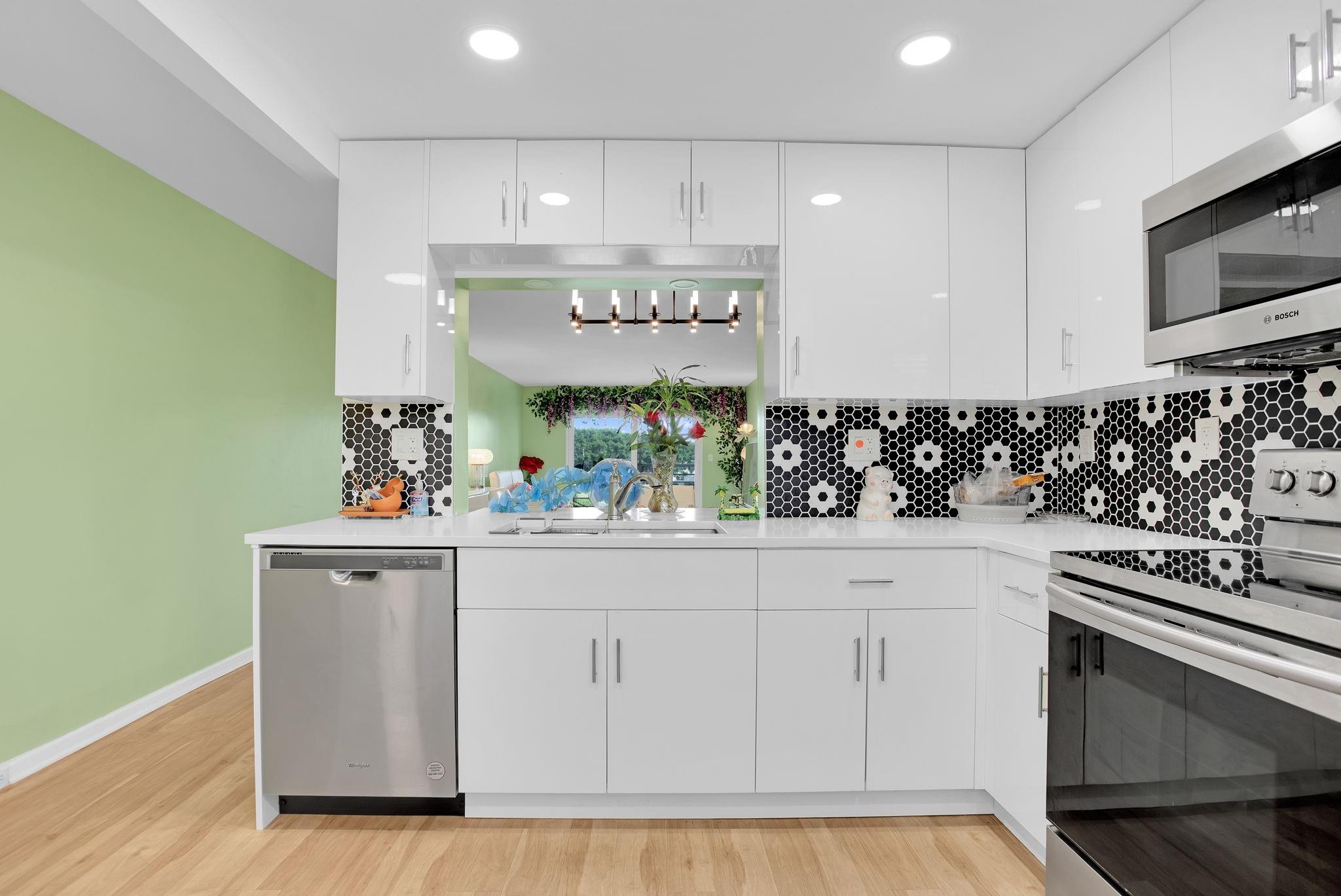 *Unmatched Opportunity Near Village Pool, Theatre, and Clubhouse Restaurant**Discover this exquisitely remodeled home that combines elegance and practicality. The gourmet kitchen features a stylish open pass-through to the dining area, perfect for entertaining. Enjoy unparalleled safety with impact-resistant windows and doors throughout. Step onto your serene screened patio and soak in breathtaking views of the private golf water. This residence boasts lavish remodeled bathrooms adorned with quartz countertops, custom closets tailored for abundant storage, and a desirable north-facing orientation that floods the space with natural light while avoiding direct sunlight. This luxurious home epitomizes comfort, security, and sophisticated living in a prime location! A/C 2022 WTRHTR $2020
