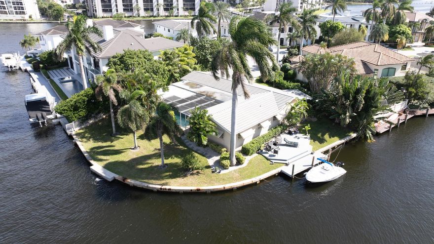 Nestled in Harbour East, this prime point lot boasts 164+/- feet of waterfront frontage. Boating enthusiasts will appreciate the ease of no fixed bridges and direct access to the Intracoastal and ocean via the Boca Raton inlet, as well as the ability to accommodate yacht dockage. This unique property presents the perfect opportunity to build a brand-new custom or spec home in the prestigious waterfront enclave that is in close proximity to downtown Boca Raton. The panoramic water views overlook the Deepwater canal on a quarter of an acre, offering an unparalleled waterfront lifestyle.