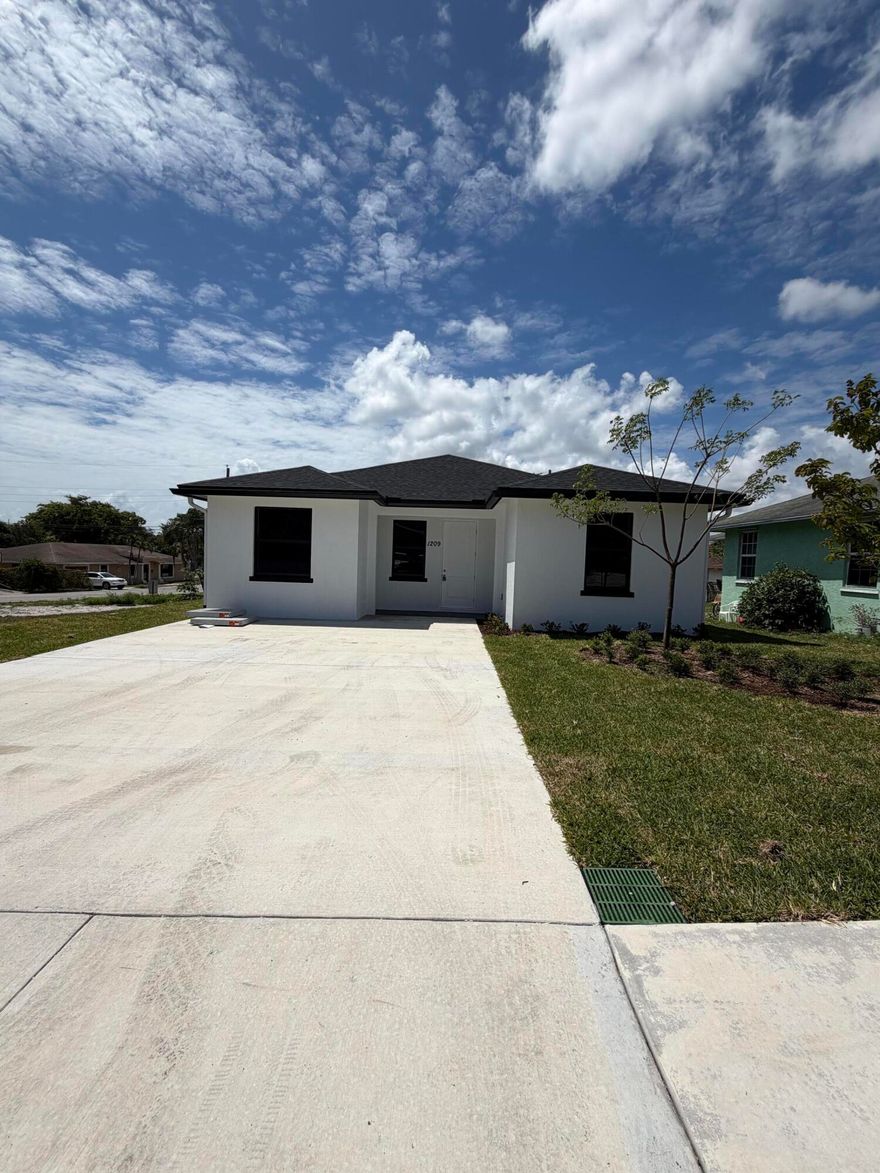 Welcome to your dream home! This brand-new, single-family gem boasts 5 bedrooms, 2 baths, and a host of features that make it a must-see property. From the moment you step through the front door, you'll be captivated. The kitchen is a chef's dream with quartz countertops, offering both style and durability. It's the perfect space for preparing meals and entertaining. The entire home is adorned with exquisite ceramic tile flooring that's not only elegant but also easy to maintain. Rest easy knowing that your home is protected with impact windows, providing safety, security, and energy efficiency. Don't miss the opportunity to make this exquisite new construction home yours.