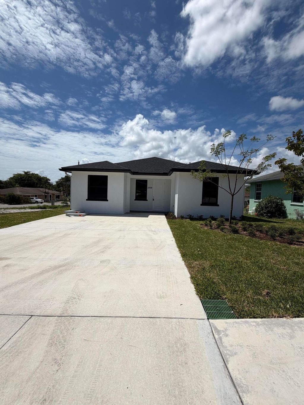 Photo of 1209 W 33rd Street, Riviera Beach, FL 33404 (MLS # B26019319)
